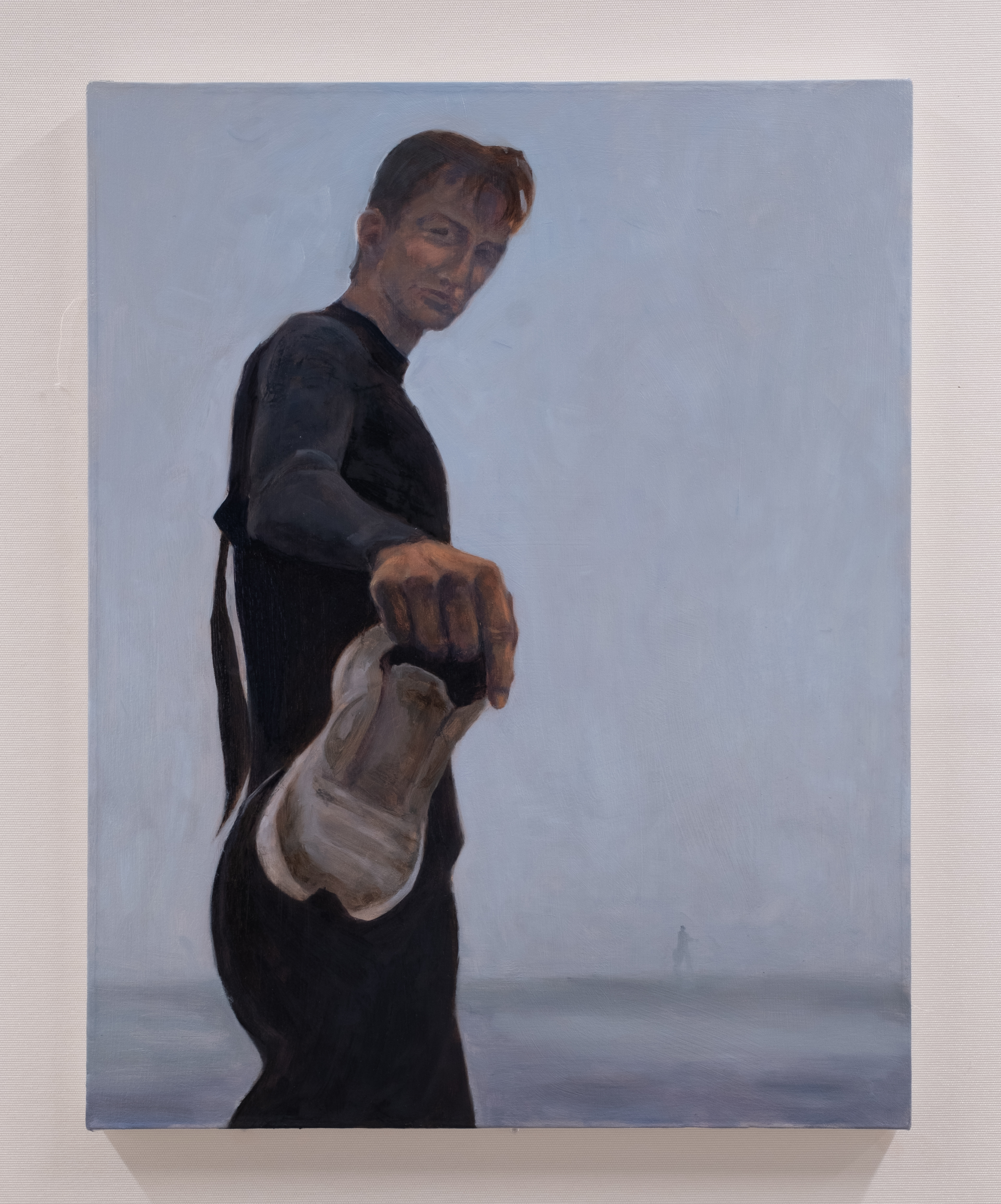 Painting of a man in a wetsuit holding out a sneaker towards the viewer.