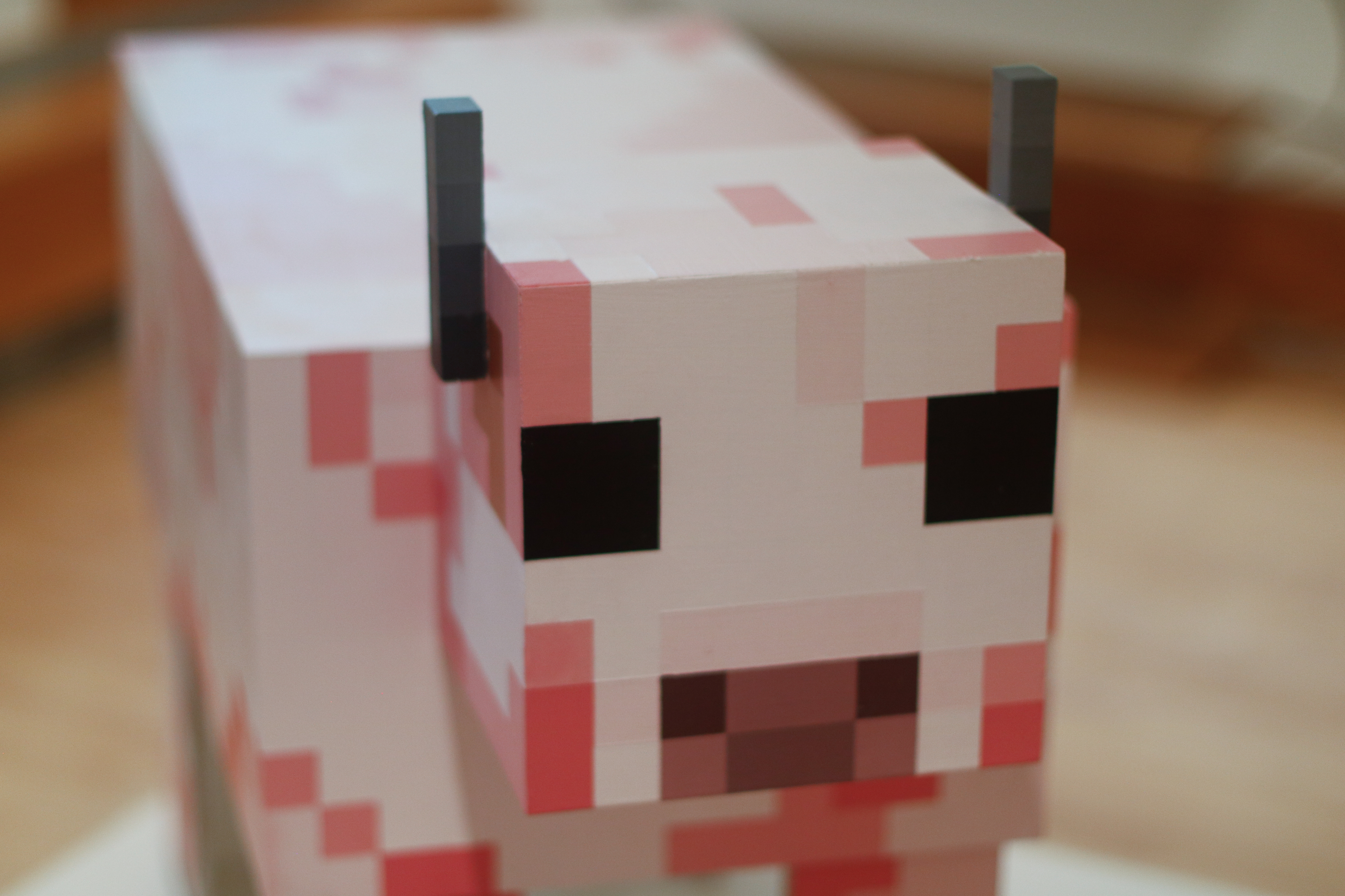 Close up details of pink Minecraft cow head.